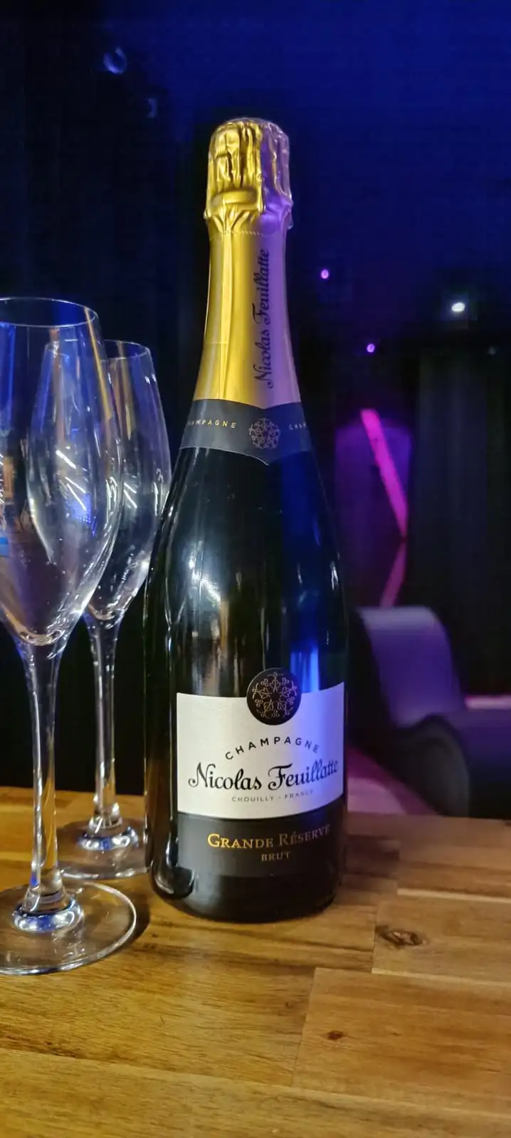 person holding clear wine glass